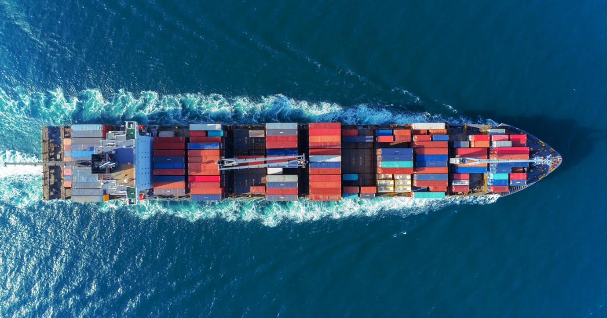 ship with shipping containers aerial view